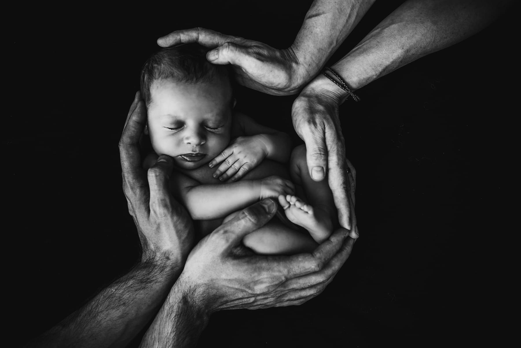 A birth photographer capturing a newborn's first moments