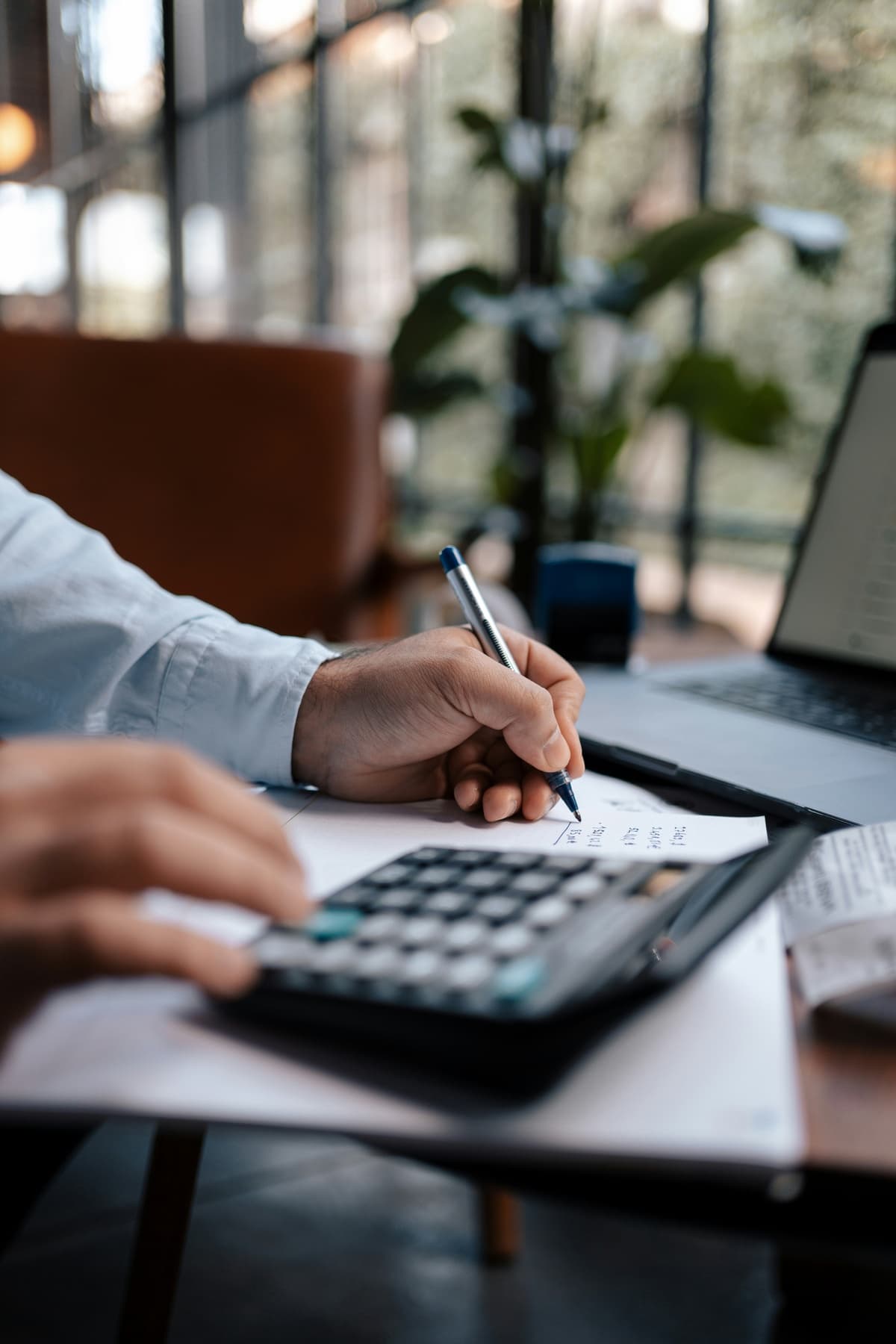 An accountant reviewing tax documents with a small-business owner