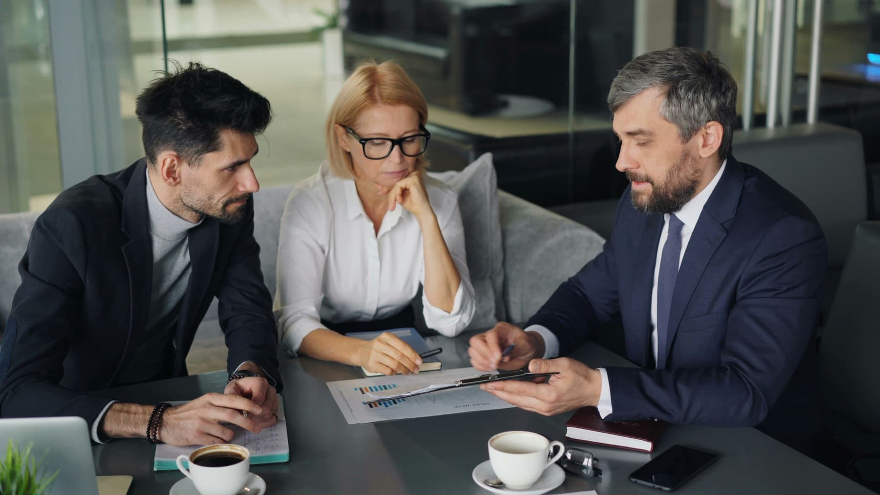 A financial advisor reviewing a retirement plan with a couple