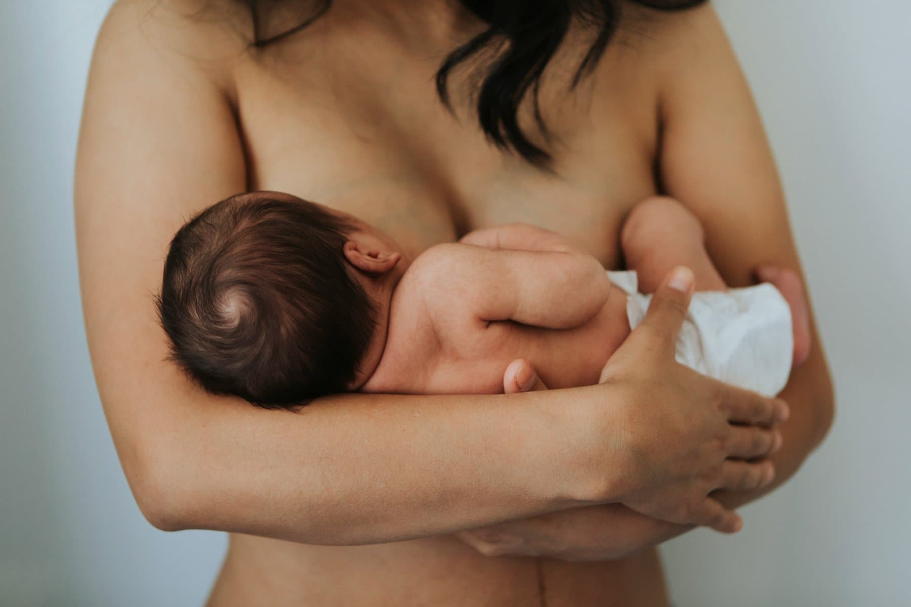 A lactation consultant helping a new parent