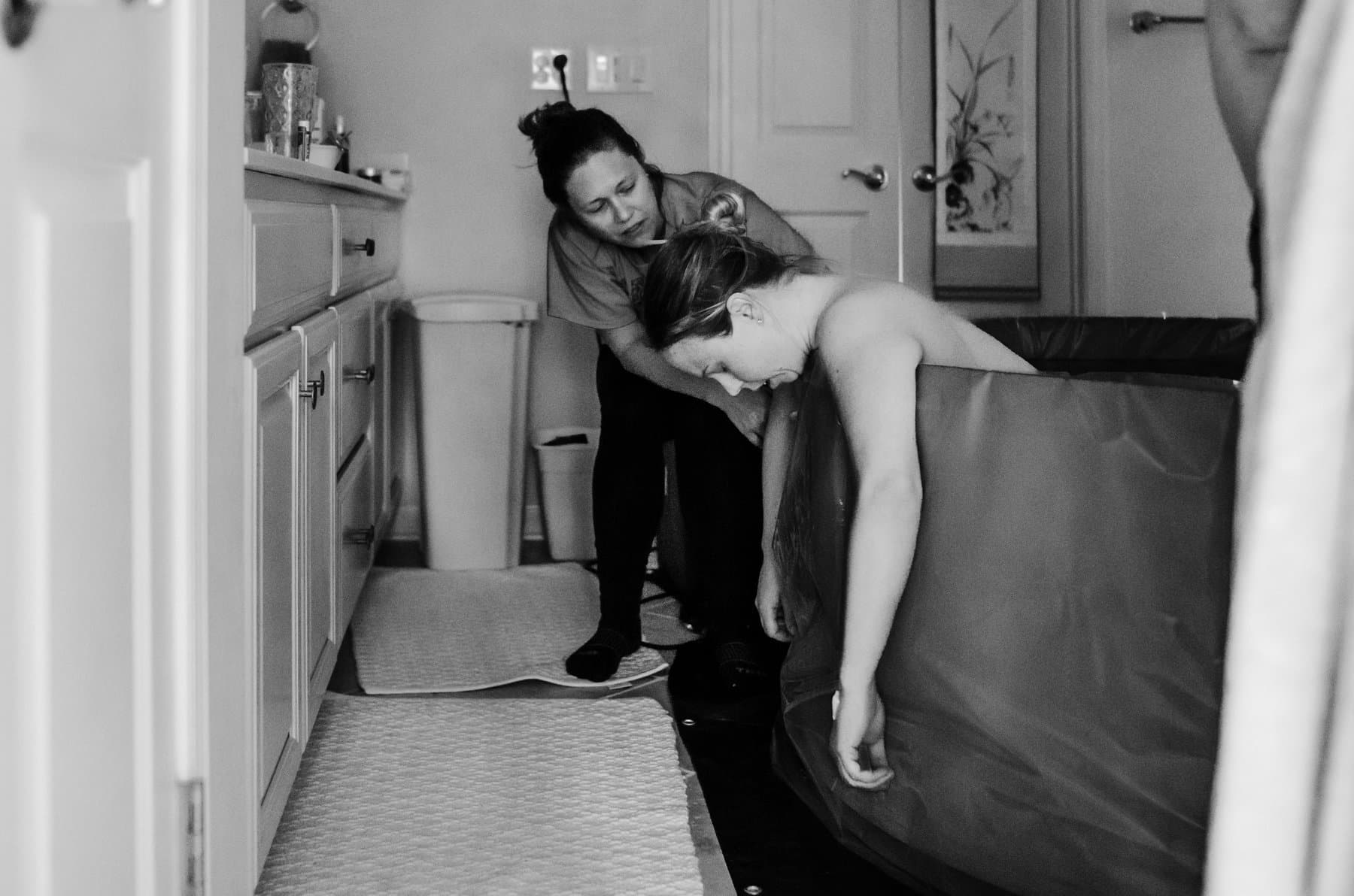 A midwife meeting with an expecting family