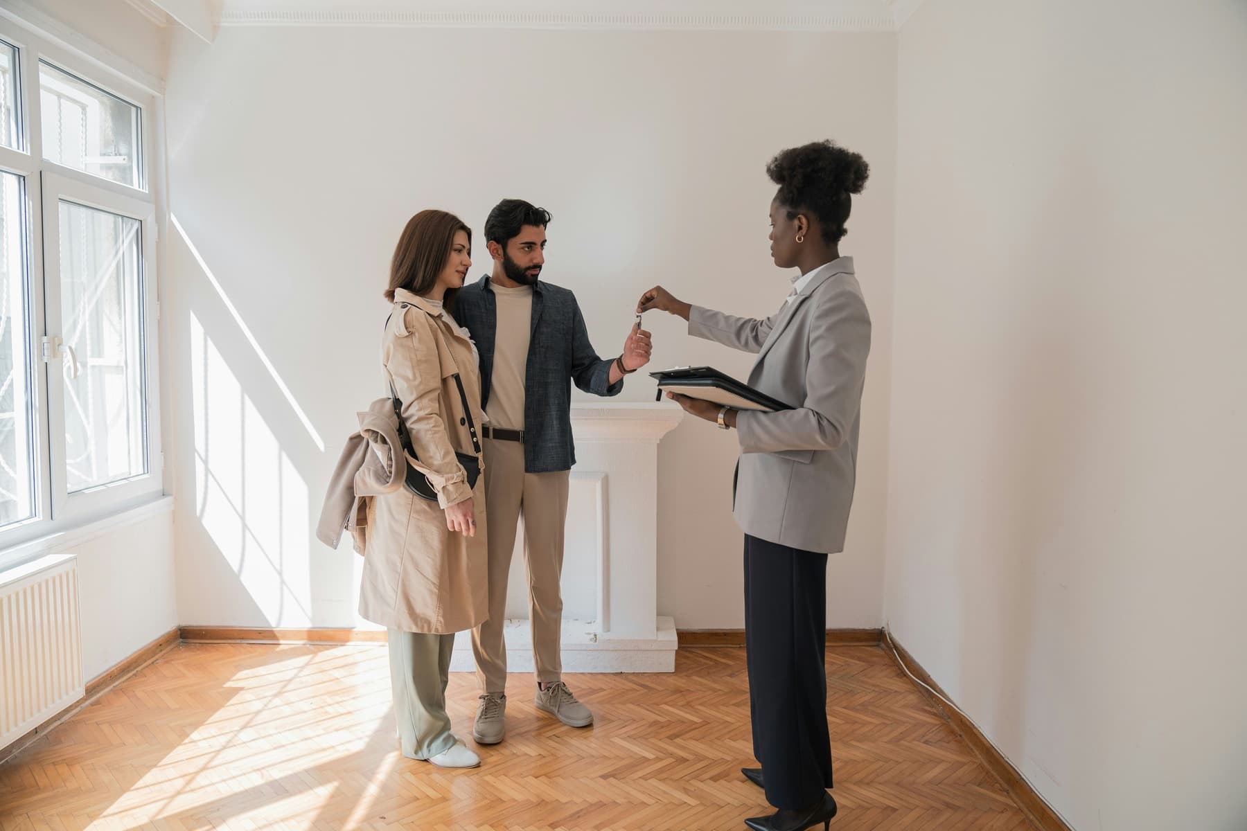A real estate agent showing a home to buyers